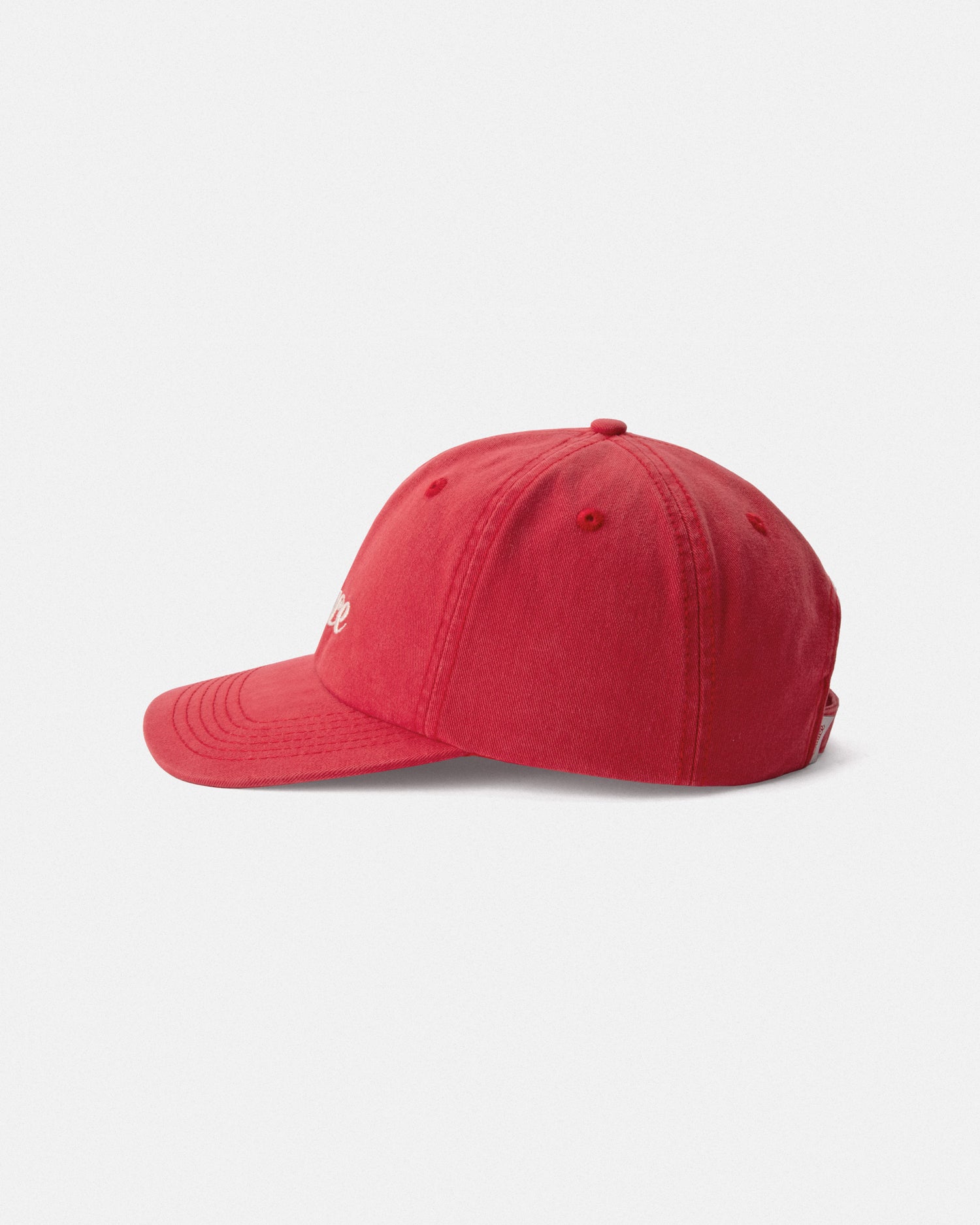 Red baseball cap on a light gray background