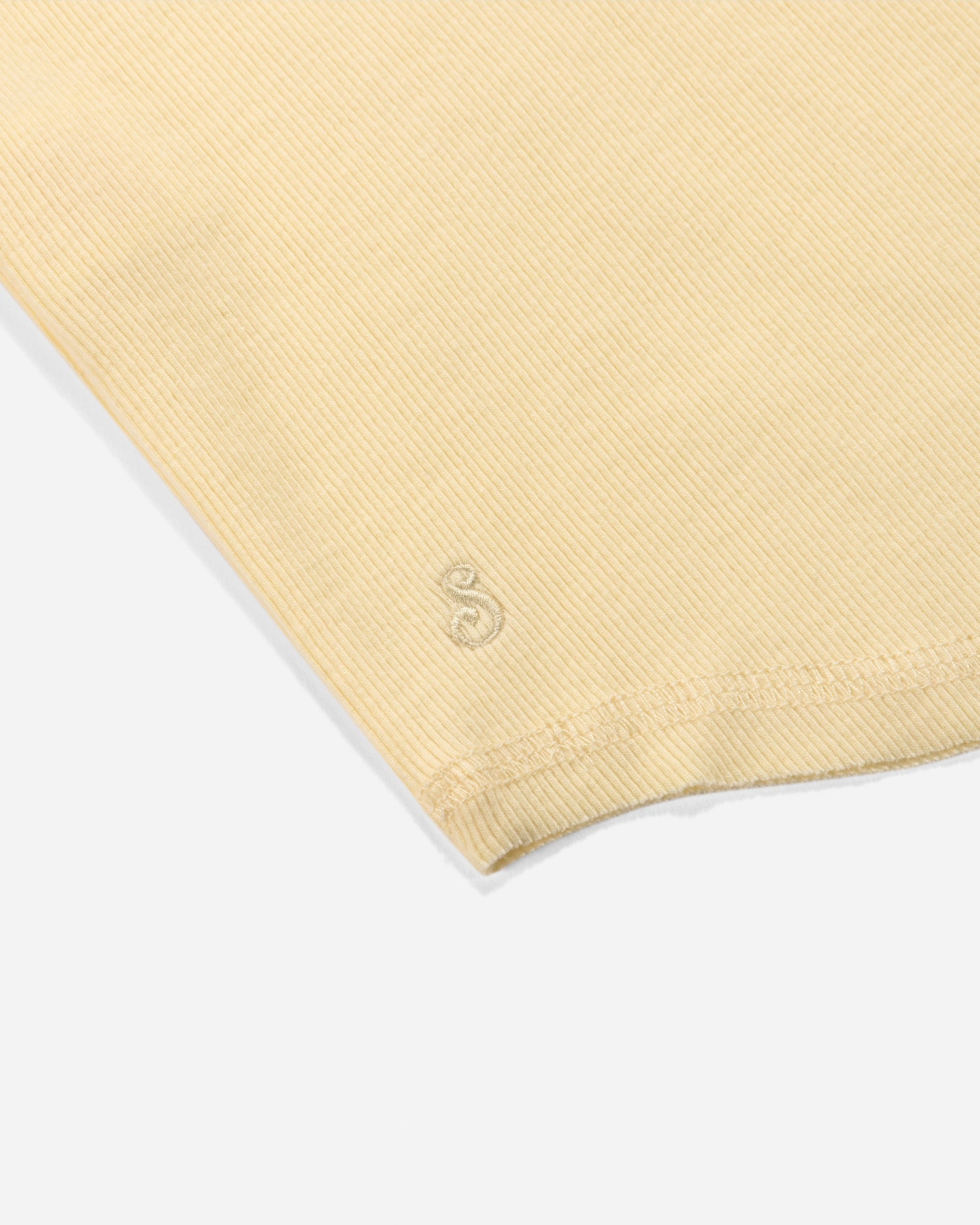 Yellow fabric with a logo on a white background