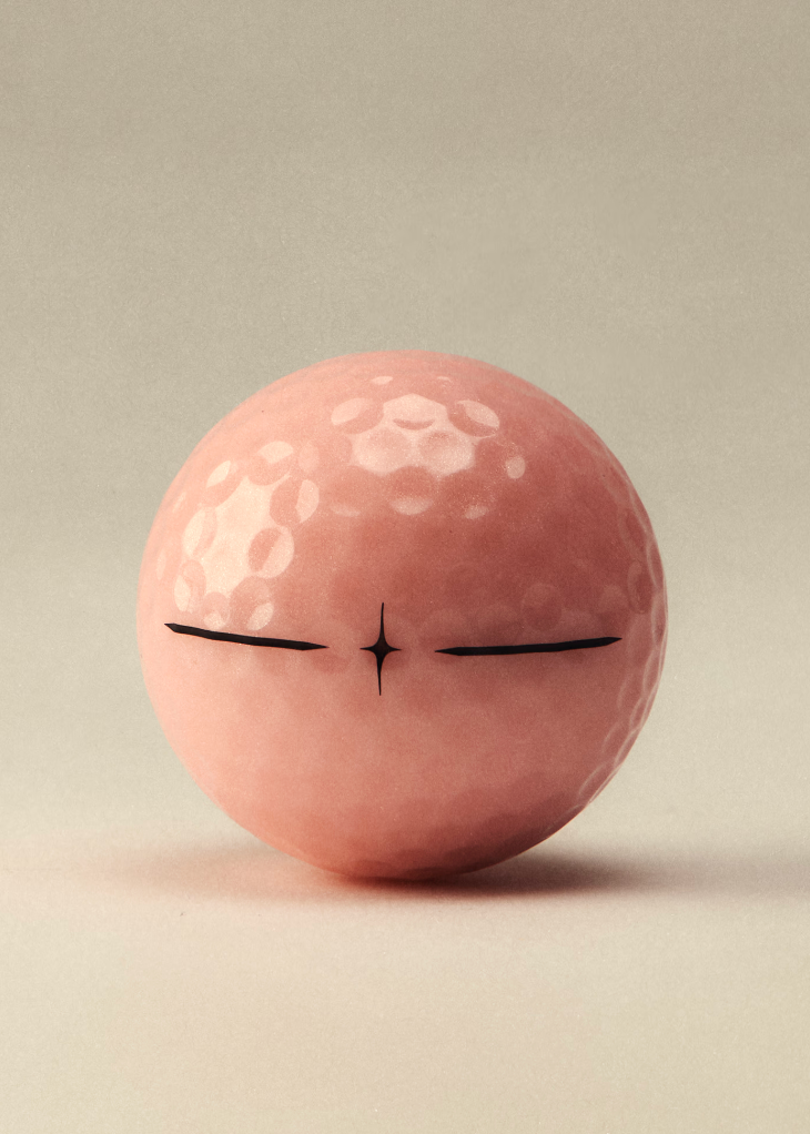 A pink golf ball with a minimalist black line-art face, centered against a warm beige background.