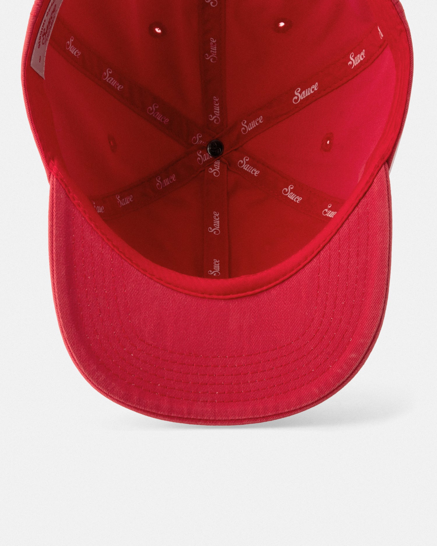 Red cap with branding on a white background