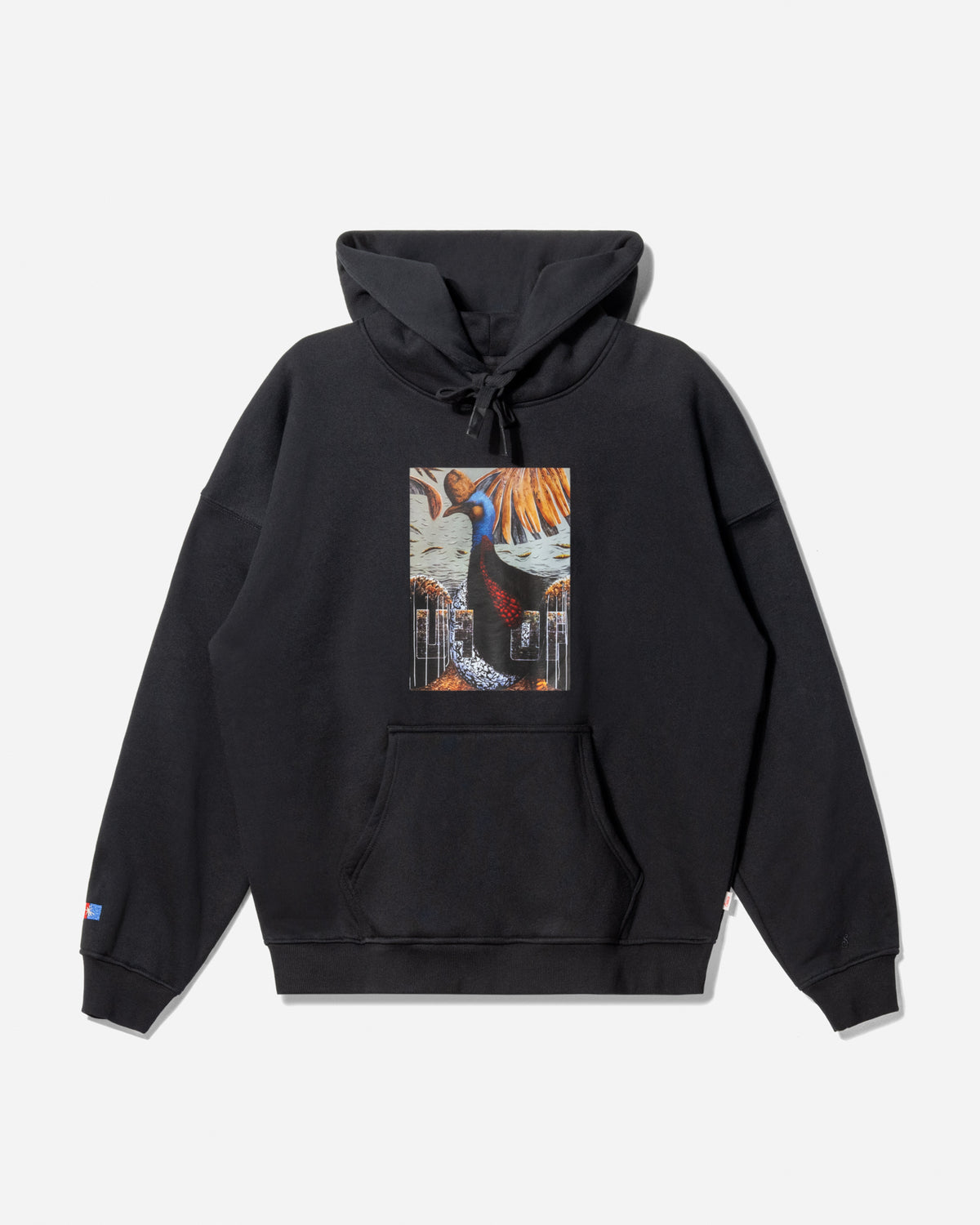 A black pullover hoodie with a drawstring hood and kangaroo pocket, featuring a colorful graphic print on the chest depicting a character from Attack on Titan, shown against a light gray background.