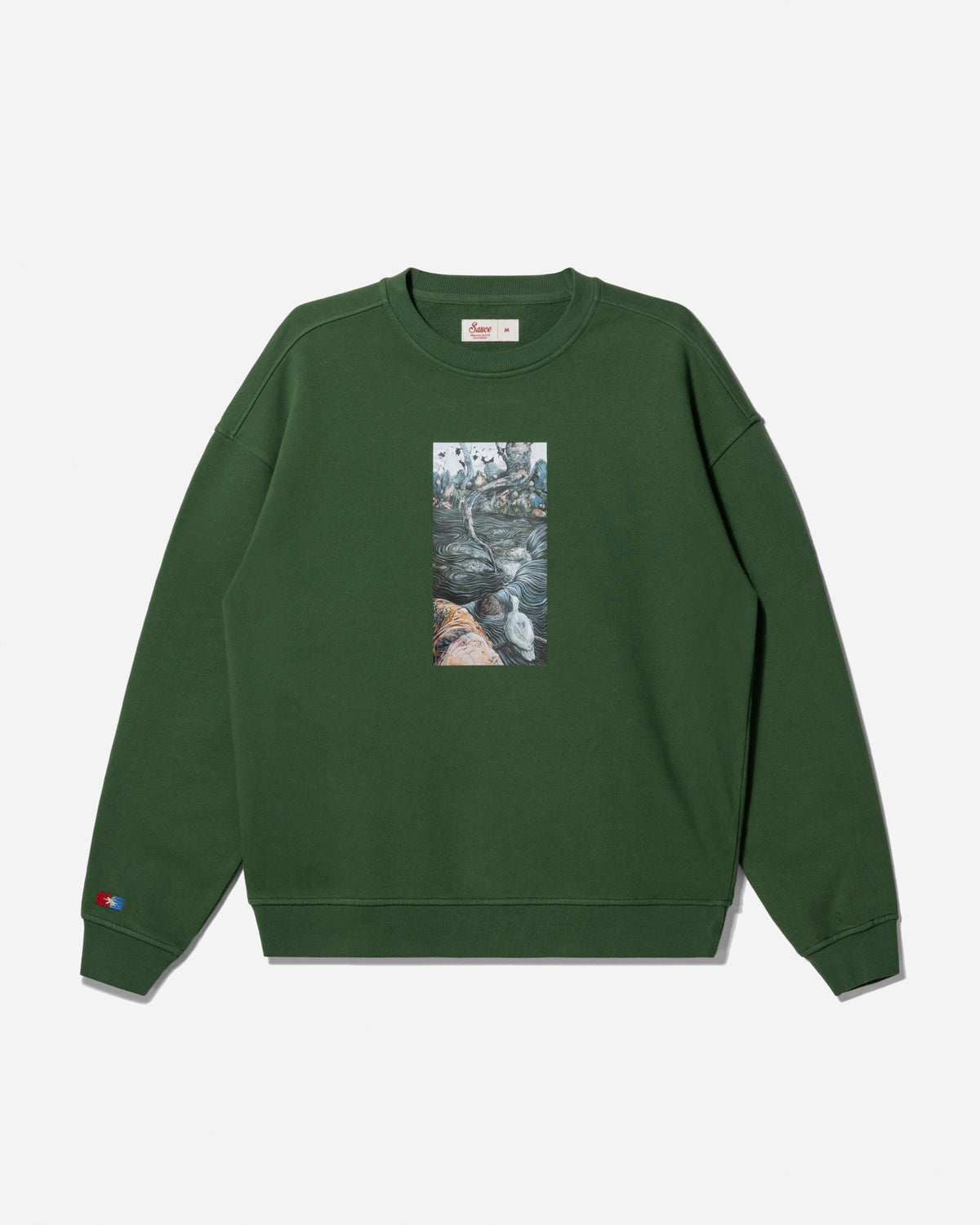 A dark green crewneck sweatshirt featuring a vertical rectangular graphic print on the chest depicting a waterfall scene, with a small red and blue Champion logo on the left sleeve cuff.